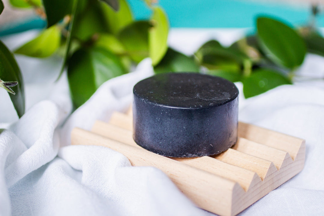 Zero Waste Activated Charcoal Face Wash Soap Bar on soap dish